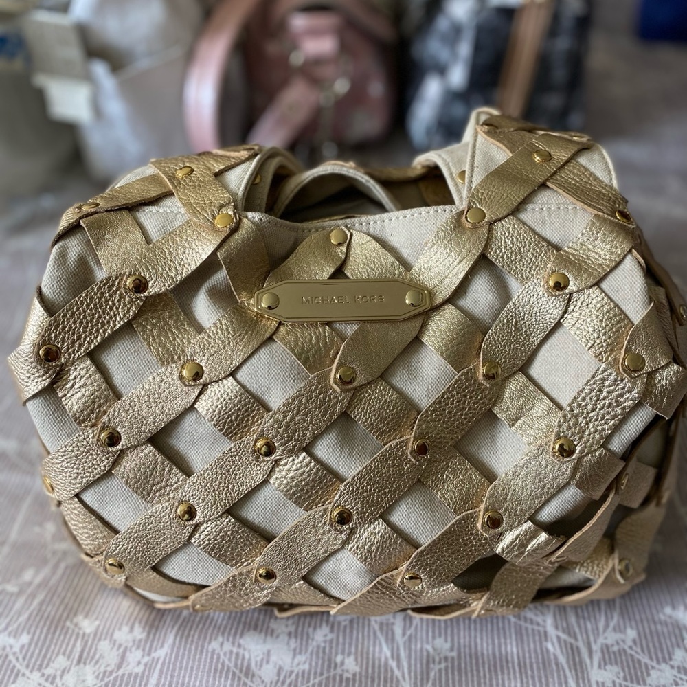 Michael Kors braided gold hand and shoulder bag.